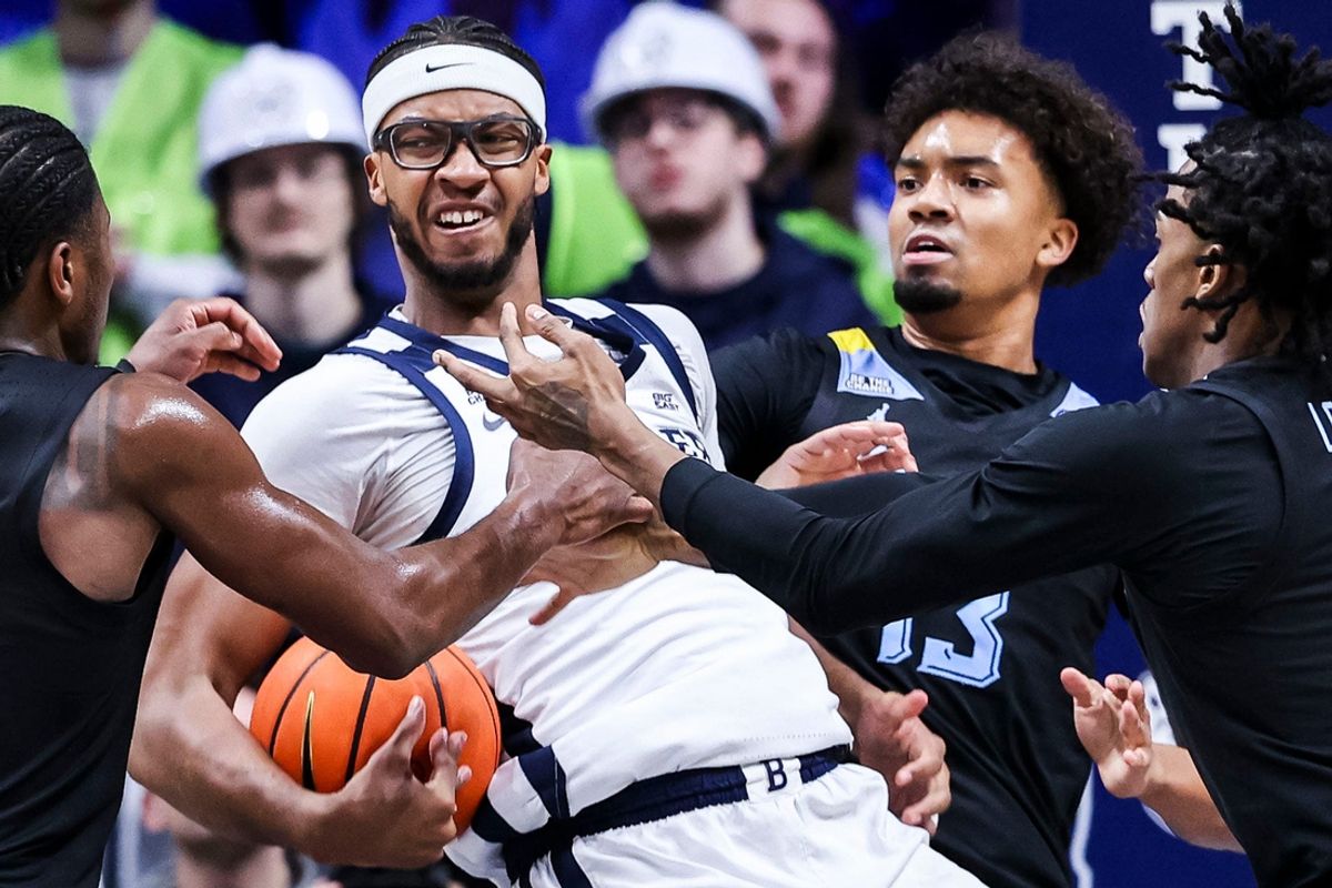 Butler Bulldogs center Andre Screen (23) looks to pass out past Marquette Golden Eagles defense Tuesday, Jan. 28, 2025, during an NCAA men’s basketball game between the Butler Bulldogs and the Marquette Golden Eagles at Hinkle Fieldhouse in Indianapolis.