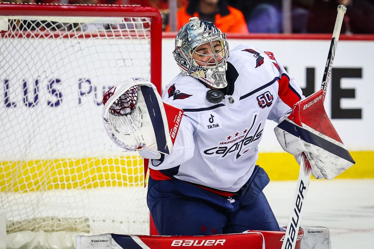 Jan 28, 2025; Calgary, Alberta, CAN; Washington Capitals goaltender Logan Thompson (48) makes a save against the Calgary Flames during the second period at Scotiabank Saddledome. Mandatory Credit: Sergei Belski-Imagn Images