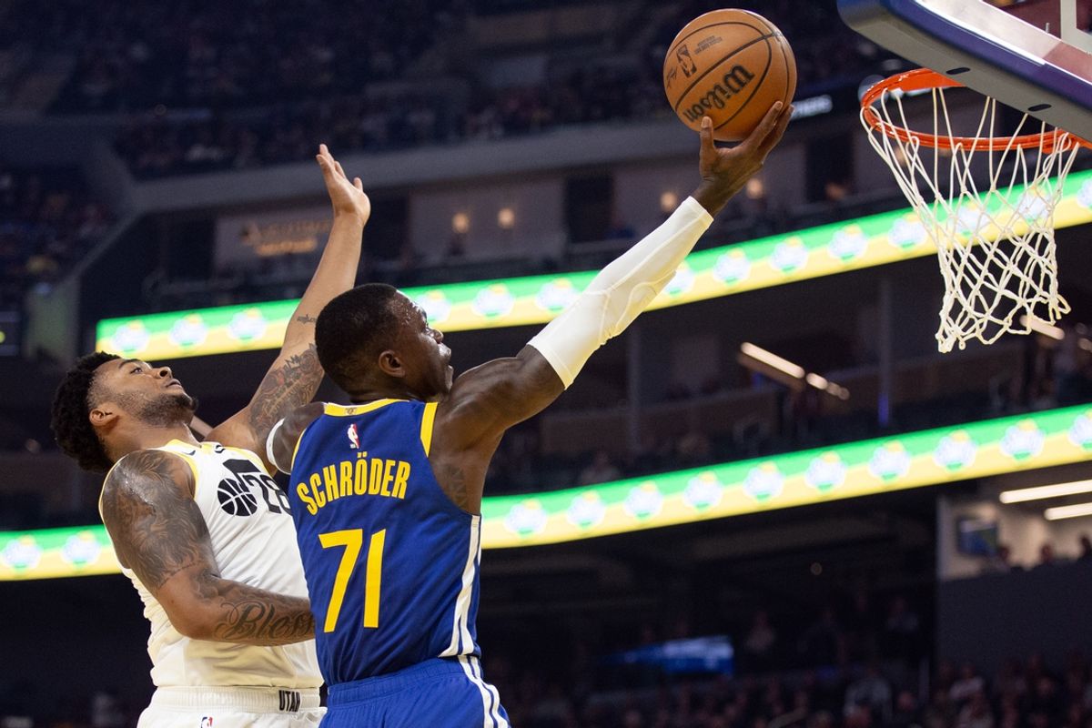 Jan 28, 2025; San Francisco, California, USA; Golden State Warriors guard Dennis Schröder (71) drives to the basket ahead of Utah Jazz forward Brice Sensabaugh (28) during the first quarter at Chase Center. Mandatory Credit: D. Ross Cameron-Imagn Images