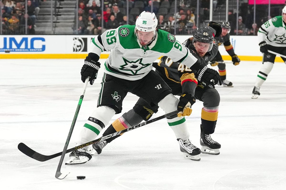Jan 28, 2025; Las Vegas, Nevada, USA; Dallas Stars center Matt Duchene (95) protects the puck from Vegas Golden Knights right wing Jonas Rondbjerg (46) during the first period at T-Mobile Arena. Mandatory Credit: Stephen R. Sylvanie-Imagn Images
