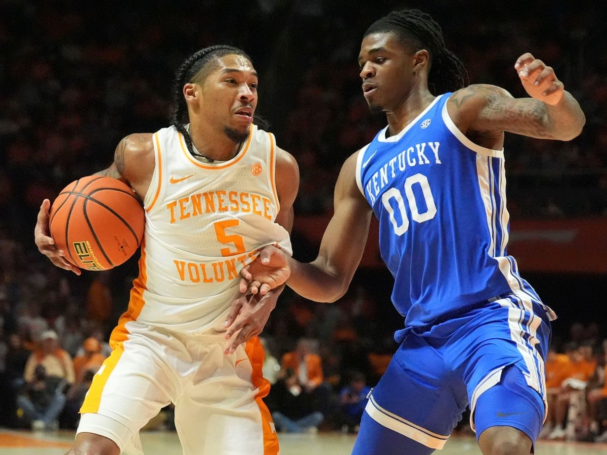 Tennessee's Zakai Zeigler (5) tries to get to the basket while guarded by Kentucky's Otega Oweh (0) during an NCAA college basketball game on Tuesday, Jan. 28, 2025, in Knoxville, Tenn.