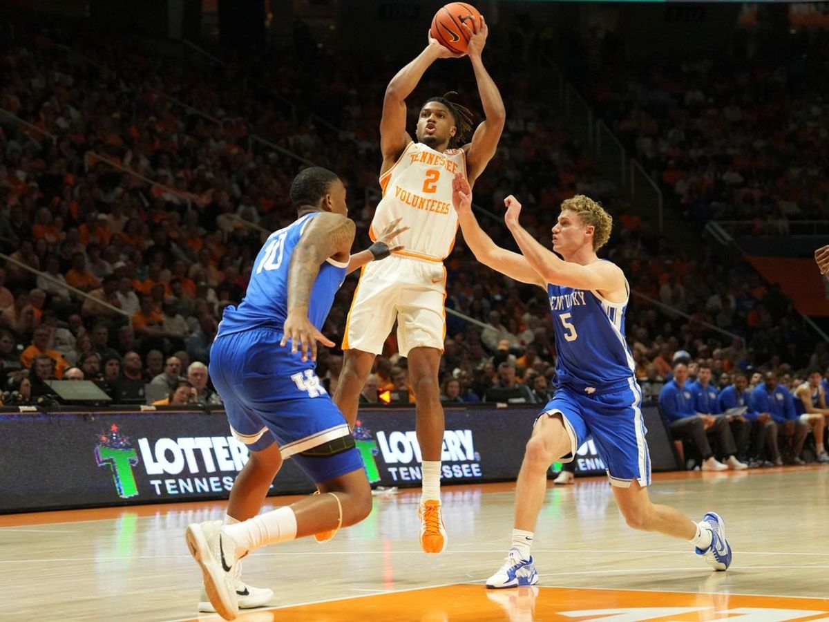 Tennessee's Chaz Lanier (2) with the shot attempt over Kentucky's Collin Chandler (5) and Brandon Garrison (10) during an NCAA college basketball game on Tuesday, Jan. 28, 2025, in Knoxville, Tenn.
