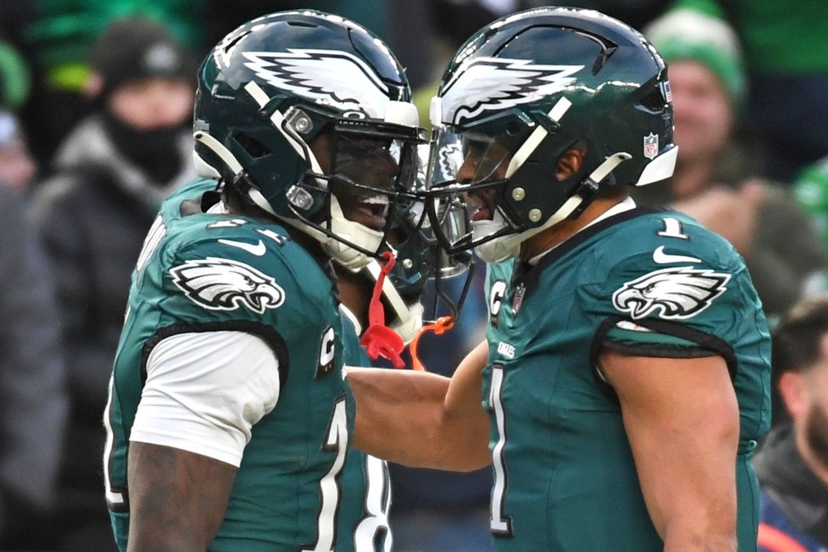 Jan 26, 2025; Philadelphia, PA, USA; Philadelphia Eagles wide receiver A.J. Brown (11) and quarterback Jalen Hurts (1) celebrate a touchdown  against the Washington Commanders in the NFC Championship game at Lincoln Financial Field. Mandatory Credit: Eric Hartline-Imagn Images