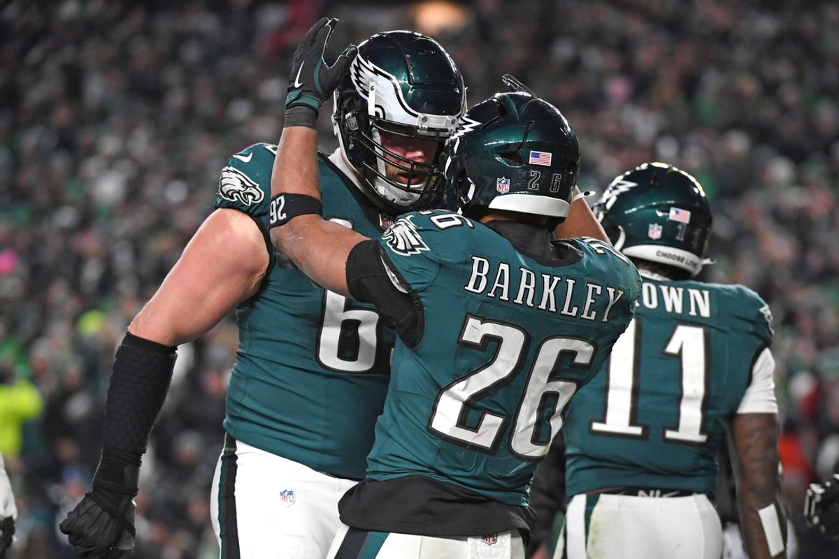 Jan 26, 2025; Philadelphia, PA, USA; Philadelphia Eagles running back Saquon Barkley (26) celebrates his touchdown with offensive tackle Lane Johnson (65) against the Washington Commanders  in the NFC Championship game at Lincoln Financial Field. Mandatory Credit: Eric Hartline-Imagn Images