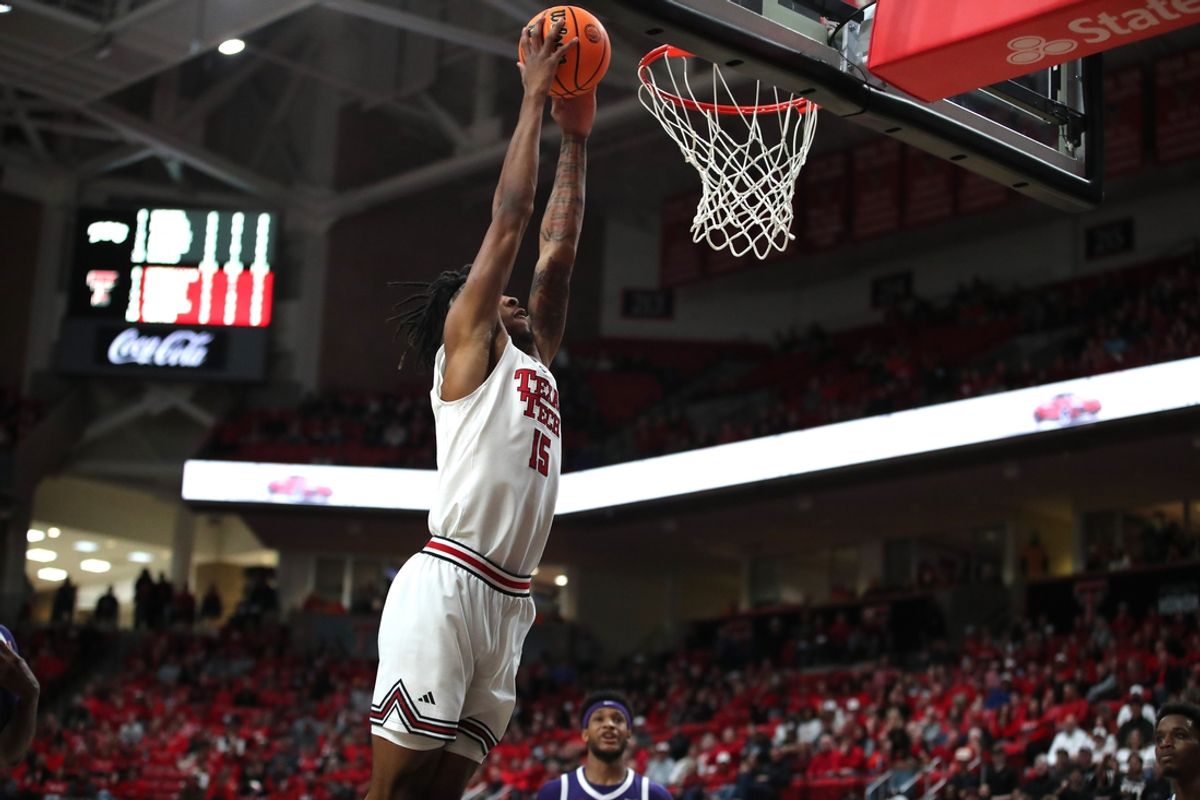 Jan 29, 2025; Lubbock, Texas, USA;  Texas Tech Red Raiders forward JT Toppin (15) goes to the basket against the Texas Christian Horned Frogs in the first half at United Supermarkets Arena. Mandatory Credit: Michael C. Johnson-Imagn Images