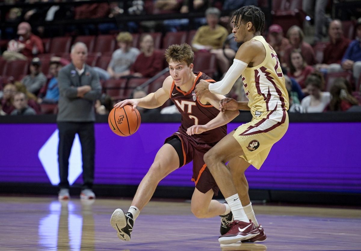 Jan 29, 2025; Tallahassee, Florida, USA; Virginia Tech Hokies guard Jaden Schutt (2) maneuvers around Florida State Seminoles guard Justin Thomas (25) during the first half at Donald L. Tucker Center. Mandatory Credit: Melina Myers-Imagn Images