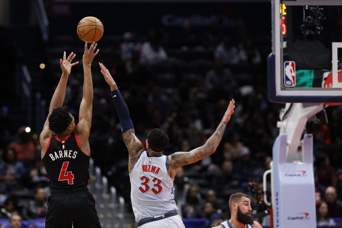 Jan 29, 2025; Washington, District of Columbia, USA; Toronto Raptors forward Scottie Barnes (4) shoots the ball over Washington Wizards forward Kyle Kuzma (33) in the second quarter at Capital One Arena. Mandatory Credit: Geoff Burke-Imagn Images