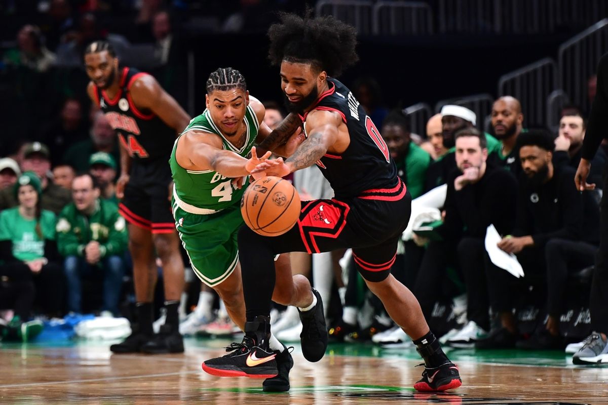 Jan 29, 2025; Boston, Massachusetts, USA; Boston Celtics guard Jaden Springer (44) and Chicago Bulls guard Coby White (0) reach for a loose ball during the first half at TD Garden. Mandatory Credit: Bob DeChiara-Imagn Images