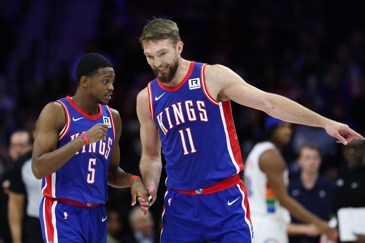 Jan 29, 2025; Philadelphia, Pennsylvania, USA; Sacramento Kings guard De'Aaron Fox (5) and forward Domantas Sabonis (11) talk during the second quarter against the Philadelphia 76ers at Wells Fargo Center. Mandatory Credit: Bill Streicher-Imagn Images