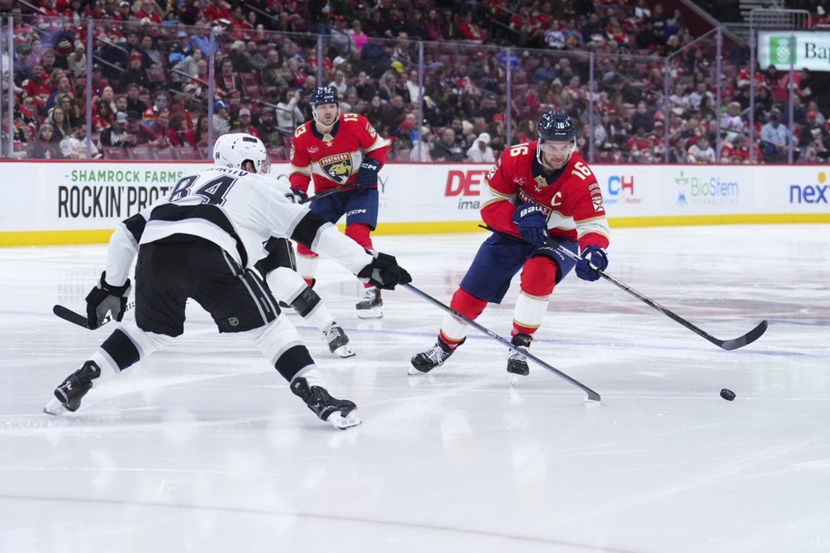 Jan 29, 2025; Sunrise, Florida, USA; Florida Panthers center Aleksander Barkov (16) skates with the puck against Los Angeles Kings defenseman Vladislav Gavrikov (84) during the second period at Amerant Bank Arena. Mandatory Credit: Rich Storry-Imagn Images