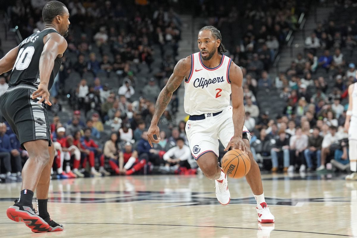 Jan 29, 2025; San Antonio, Texas, USA;  LA Clippers forward Kawhi Leonard (2) dribbles in front of San Antonio Spurs forward Harrison Barnes (40) in the first half at Frost Bank Center. Mandatory Credit: Daniel Dunn-Imagn Images