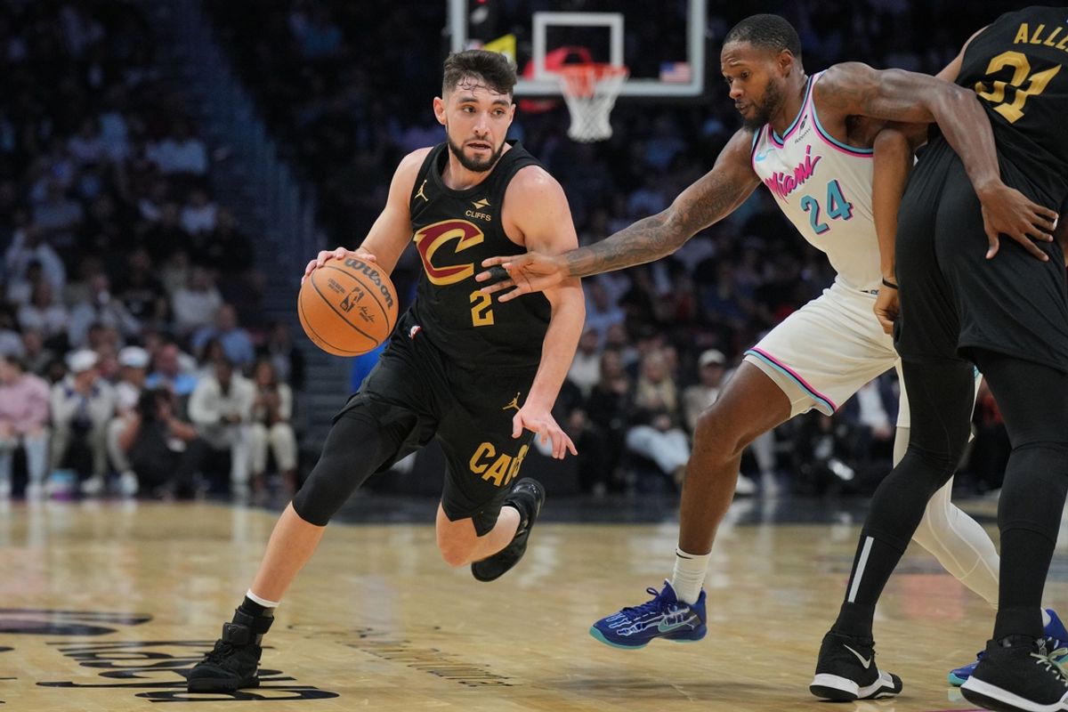 Jan 29, 2025; Miami, Florida, USA;  Cleveland Cavaliers guard Ty Jerome (2) drives past Miami Heat forward Haywood Highsmith (24) during the first half at Kaseya Center. Mandatory Credit: Jim Rassol-Imagn Images