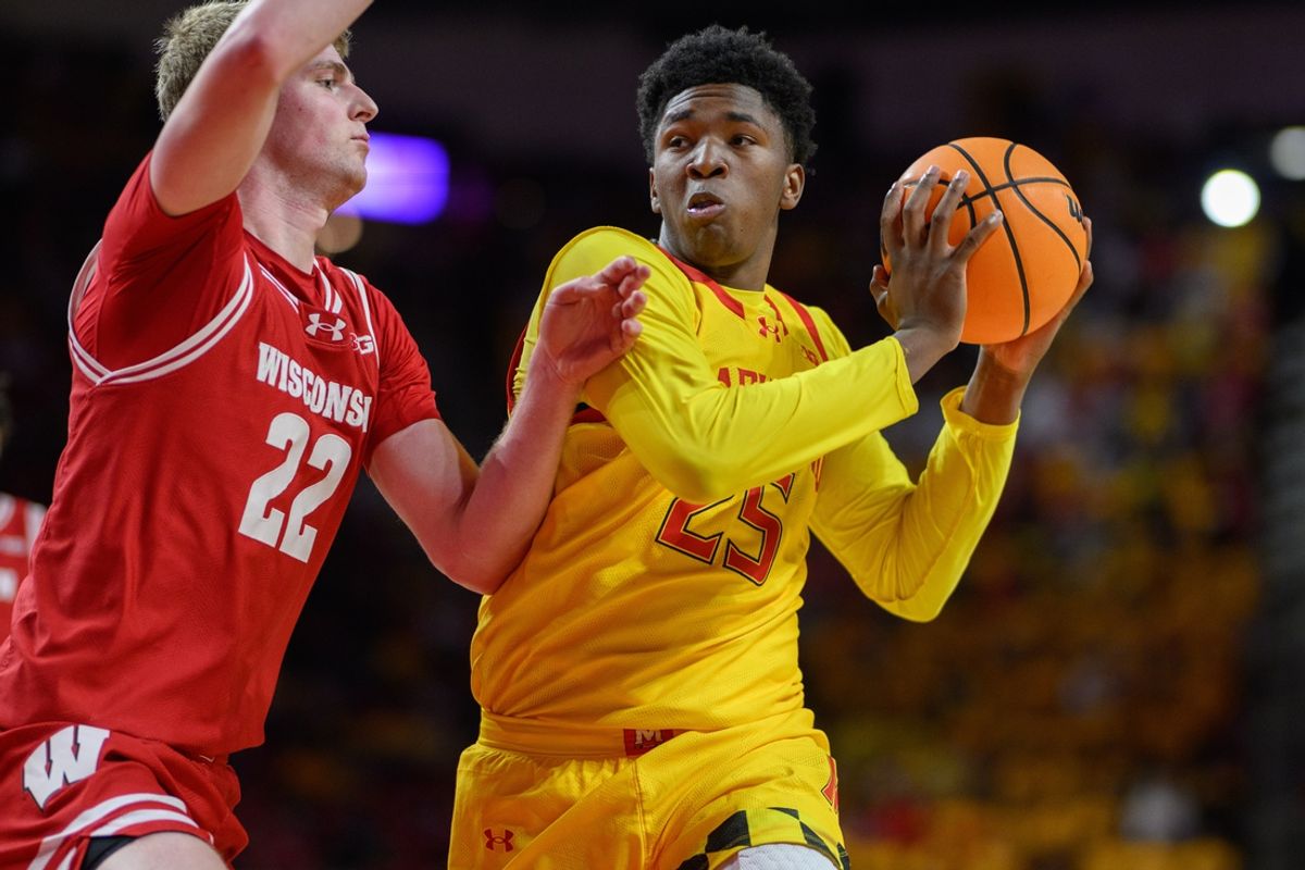Jan 29, 2025; College Park, Maryland, USA; Maryland Terrapins center Derik Queen (25) drives to the basket against Wisconsin Badgers forward Steven Crowl (22) during the second half at Xfinity Center. Mandatory Credit: Reggie Hildred-Imagn Images