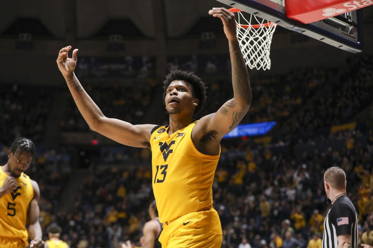 Jan 29, 2025; Morgantown, West Virginia, USA; West Virginia Mountaineers forward Amani Hansberry (13) celebrates after a play during the second half against the Houston Cougars at WVU Coliseum. Mandatory Credit: Ben Queen-Imagn Images
