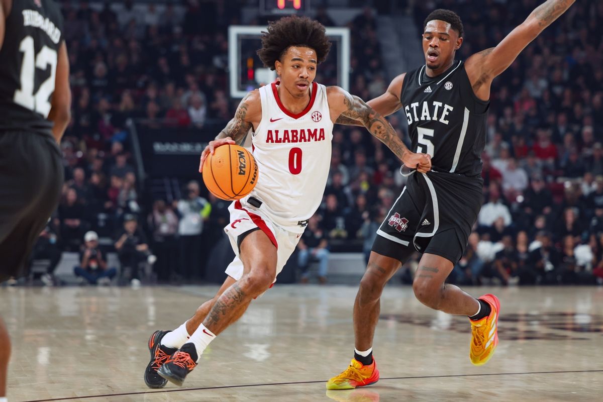 Jan 29, 2025; Starkville, Mississippi, USA; Alabama Crimson Tide guard Labaron Philon (0) drives to the basket against Mississippi State Bulldogs guard Shawn Jones Jr. (5) during the first half at Humphrey Coliseum. Mandatory Credit: Wesley Hale-Imagn Images