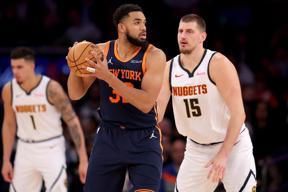 Jan 29, 2025; New York, New York, USA; New York Knicks center Karl-Anthony Towns (32) controls the ball against Denver Nuggets center Nikola Jokic (15) during the third quarter at Madison Square Garden. Mandatory Credit: Brad Penner-Imagn Images