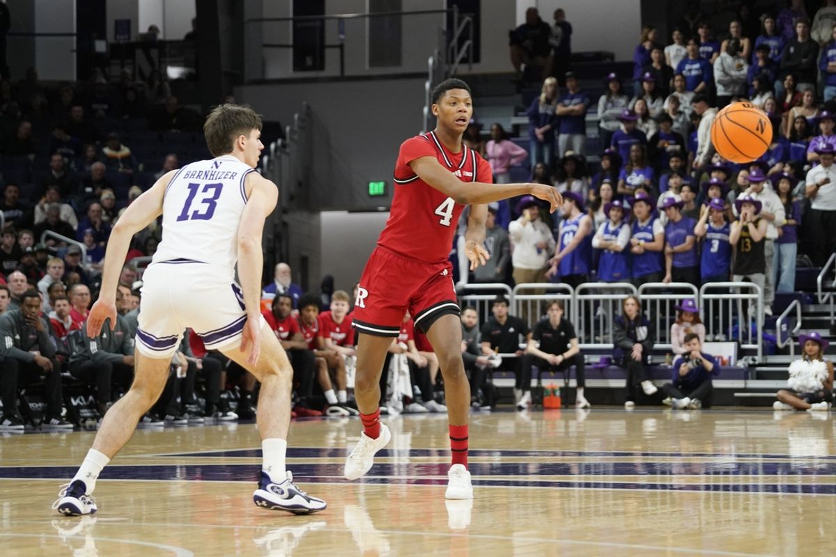 Jan 29, 2025; Evanston, Illinois, USA; Northwestern Wildcats guard Brooks Barnhizer (13) defends Rutgers Scarlet Knights guard Ace Bailey (4) during the first half at Welsh-Ryan Arena. Mandatory Credit: David Banks-Imagn Images