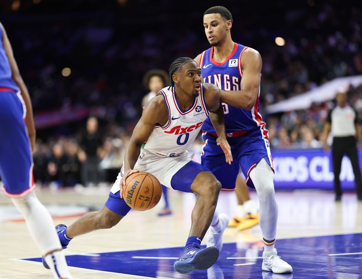 Jan 29, 2025; Philadelphia, Pennsylvania, USA; Philadelphia 76ers guard Tyrese Maxey (0) drives against Sacramento Kings forward Keegan Murray (13) during the fourth quarter at Wells Fargo Center. Mandatory Credit: Bill Streicher-Imagn Images