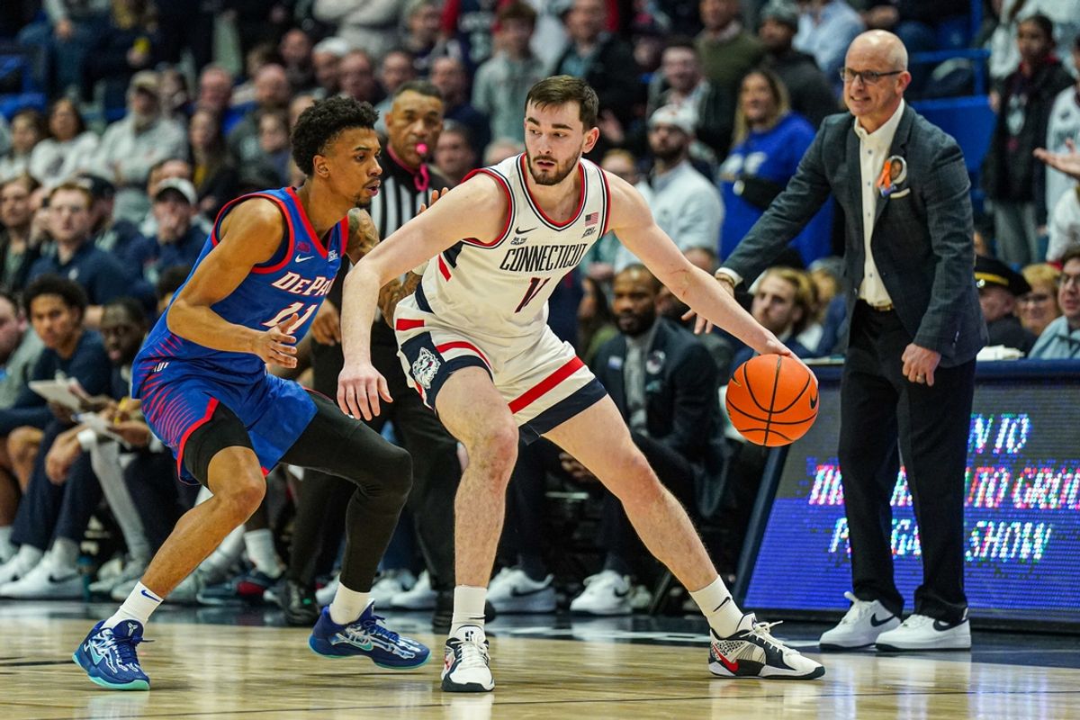 Jan 29, 2025; Hartford, Connecticut, USA; UConn Huskies forward Alex Karaban (11) moves the ball against DePaul Blue Demons guard CJ Gunn (11) in the second half at XL Center. Mandatory Credit: David Butler II-Imagn Images