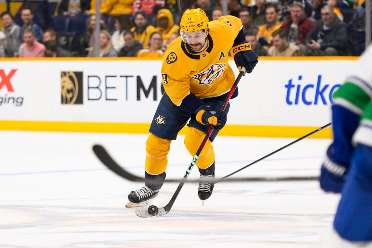 Jan 29, 2025; Nashville, Tennessee, USA;  Nashville Predators left wing Filip Forsberg (9) skates with the puck during the first period at Bridgestone Arena. Mandatory Credit: Steve Roberts-Imagn Images