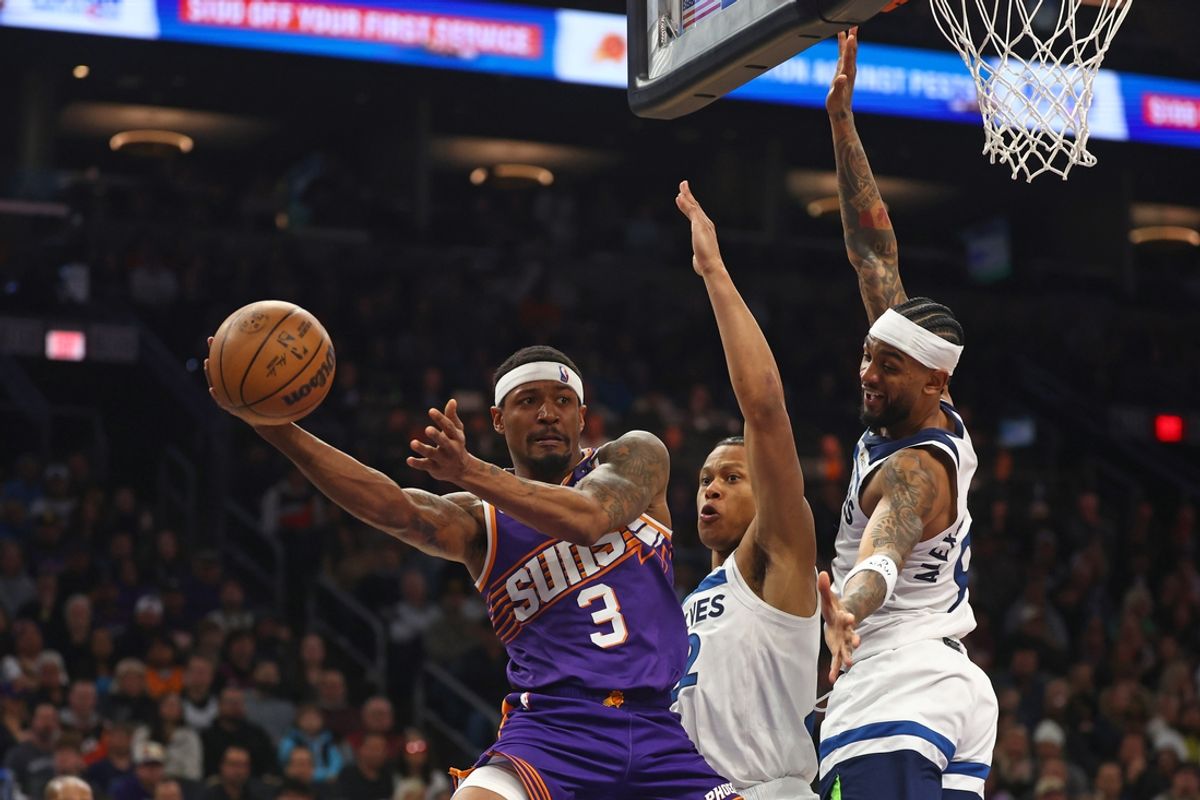 Jan 29, 2025; Phoenix, Arizona, USA; Phoenix Suns guard Bradley Beal (3) makes a pass against Minnesota Timberwolves guard Nickeil Alexander-Walker (9) in the second half at Footprint Center. Mandatory Credit: Mark J. Rebilas-Imagn Images