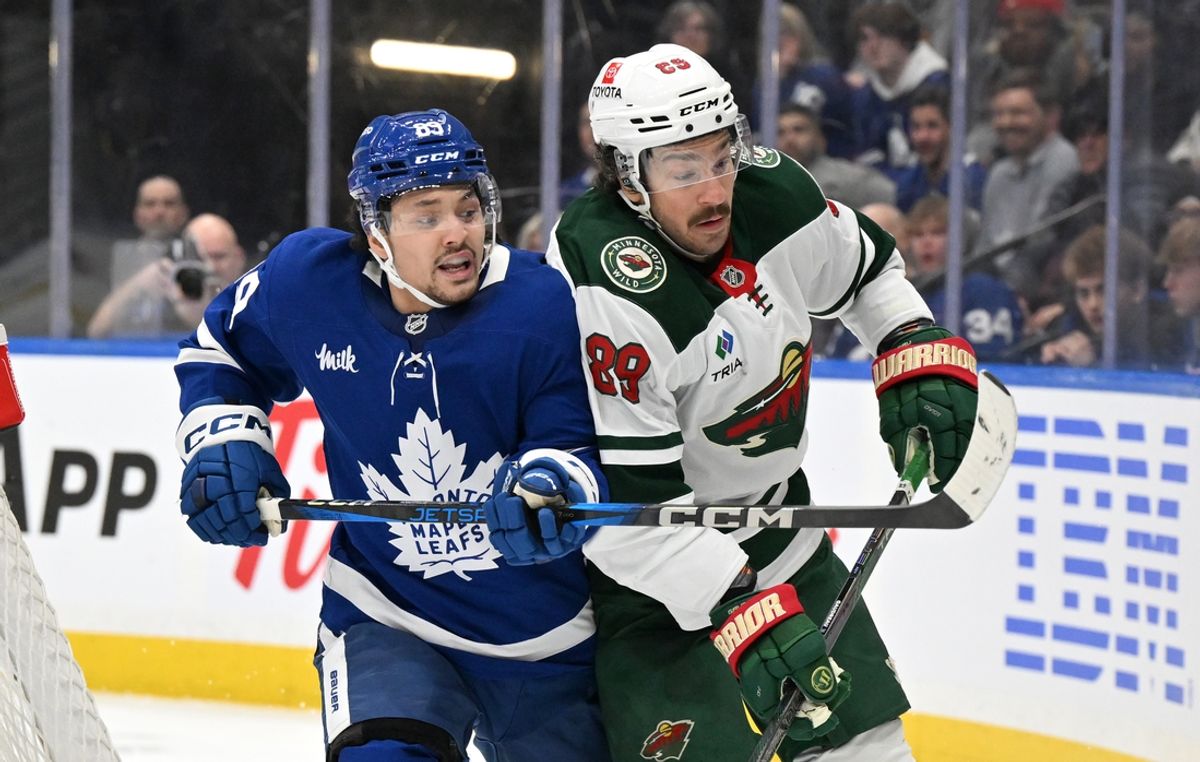 Jan 29, 2025; Toronto, Ontario, CAN; Toronto Maple Leafs forward Nick Robertson (89) tries to get past Minnesota Wild forward Frederick Gaudreau (89) in the third period at Scotiabank Arena. Mandatory Credit: Dan Hamilton-Imagn Images