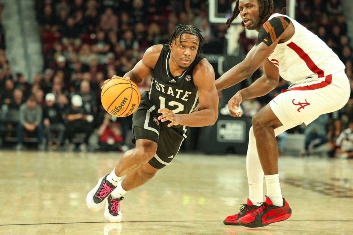 Jan 29, 2025; Starkville, Mississippi, USA; Mississippi State Bulldogs guard Josh Hubbard (12) drives to the basket against the Alabama Crimson Tide during the second half at Humphrey Coliseum. Mandatory Credit: Wesley Hale-Imagn Images