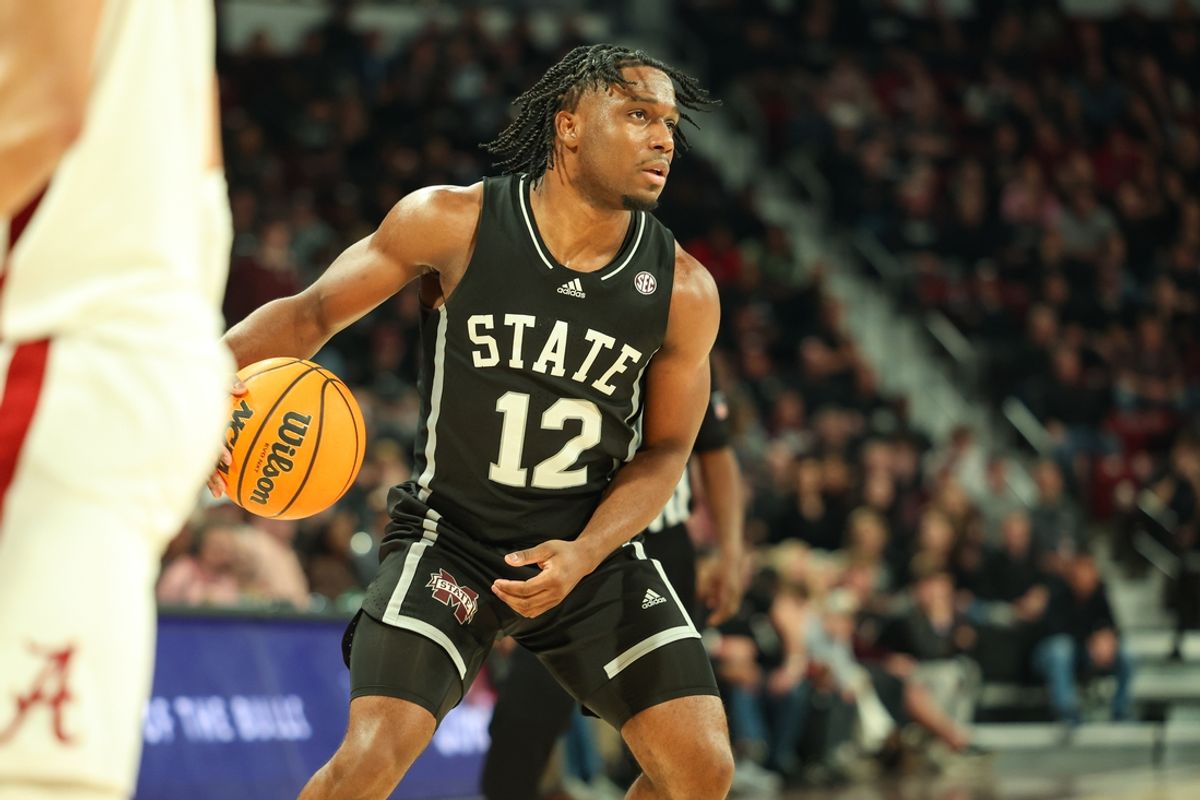 Jan 29, 2025; Starkville, Mississippi, USA; Mississippi State Bulldogs guard Josh Hubbard (12) looks to pass the ball against the Alabama Crimson Tide during the second half at Humphrey Coliseum. Mandatory Credit: Wesley Hale-Imagn Images
