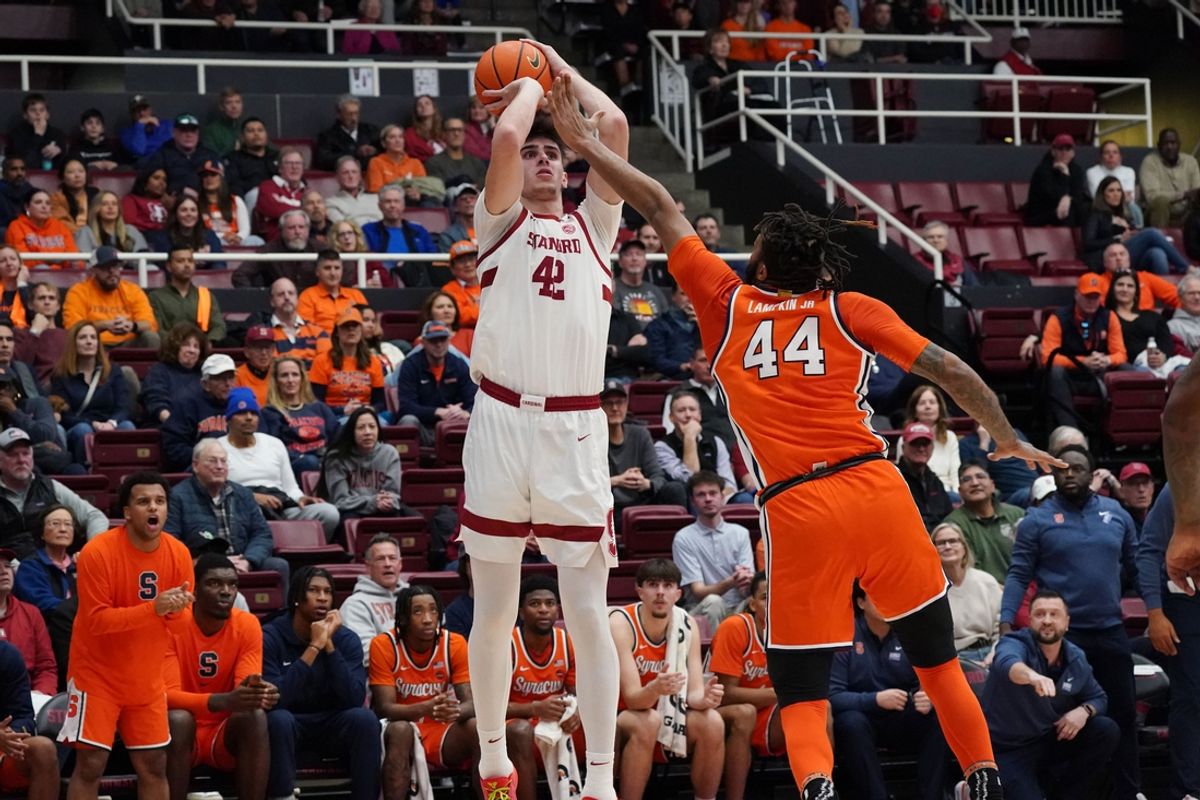 Jan 29, 2025; Stanford, California, USA;  Stanford Cardinal forward Maxime Raynaud (42) shoots over Syracuse Orange center Eddie Lampkin Jr. (44)during the first half at Maples Pavilion. Mandatory Credit: David Gonzales-Imagn Images