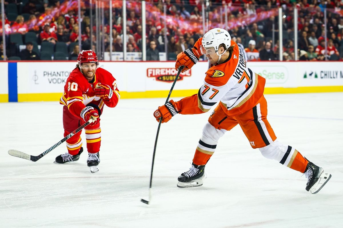 Jan 30, 2025; Calgary, Alberta, CAN; Anaheim Ducks right wing Frank Vatrano (77) scores a goal against the Calgary Flames during the first period at Scotiabank Saddledome. Mandatory Credit: Sergei Belski-Imagn Images