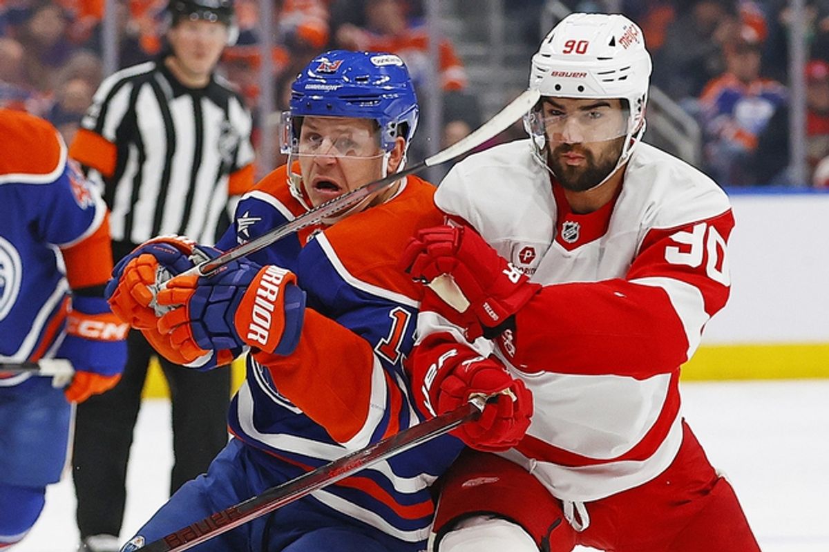 Jan 30, 2025; Edmonton, Alberta, CAN; Edmonton Oilers forward Mattias Janmark (13) and Detroit Red Wings forward Joe Veleno (90) battle for position during the first period at Rogers Place. Mandatory Credit: Perry Nelson-Imagn Images