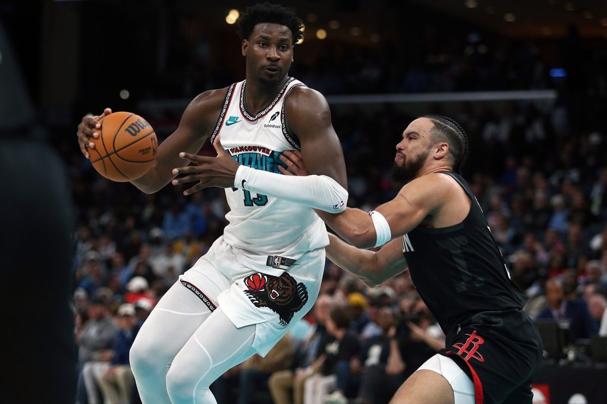 Jan 30, 2025; Memphis, Tennessee, USA; Memphis Grizzlies forward Jaren Jackson Jr. (13) drives to the basket as Houston Rockets forward Dillon Brooks (9) defends during the second quarter at FedExForum. Mandatory Credit: Petre Thomas-Imagn Images