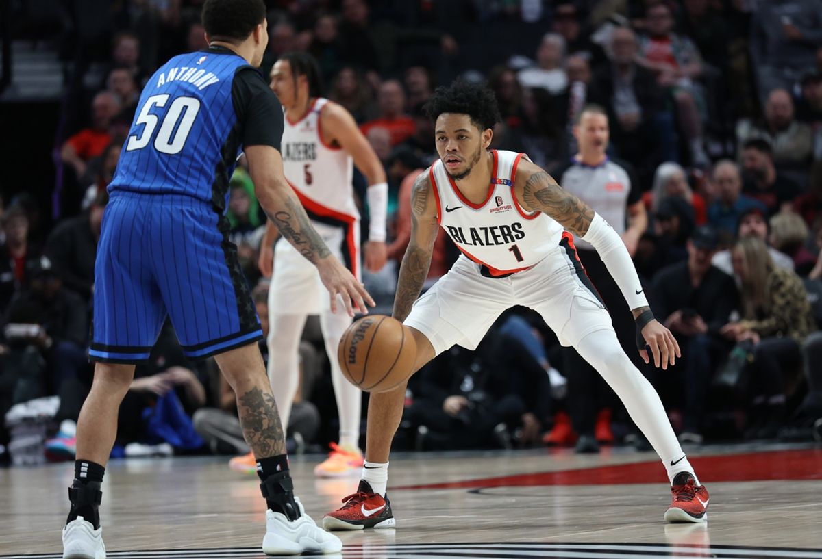 Jan 30, 2025; Portland, Oregon, USA;  Portland Trail Blazers guard Anfernee Simons (1) defends against Orlando Magic guard Cole Anthony (50) in the first half at Moda Center. Mandatory Credit: Jaime Valdez-Imagn Images