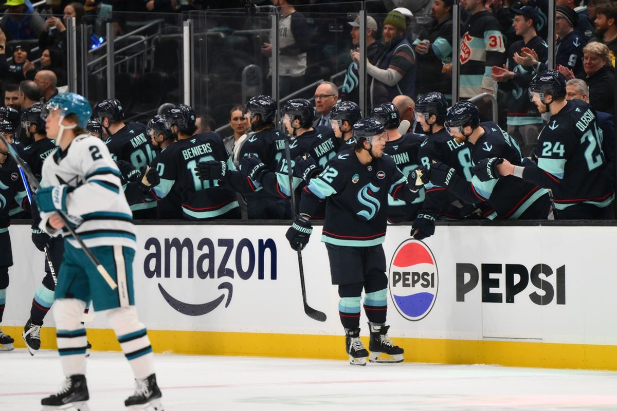 Jan 30, 2025; Seattle, Washington, USA; Seattle Kraken defenseman Brandon Montour (62) celebrates with the bench after scoring a goal against the San Jose Sharks during the second period at Climate Pledge Arena. Mandatory Credit: Steven Bisig-Imagn Images