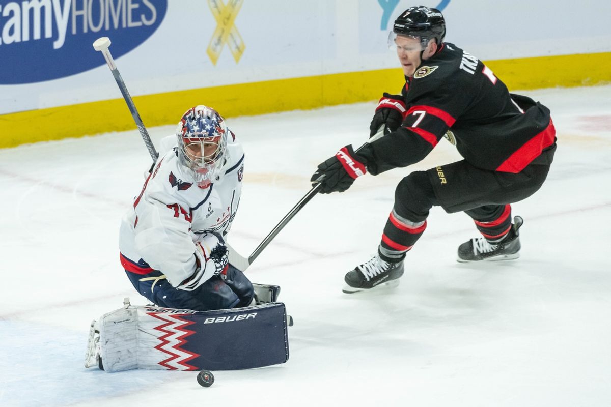Jan 30, 2025; Ottawa, Ontario, CAN; Washington Capitals goalie Charlie Lundgren (79) makes a save on a shot from Ottawa Senators left wing Brady Tkachuk (7) in the third period at the Canadian Tire Centre. Mandatory Credit: Marc DesRosiers-Imagn Images