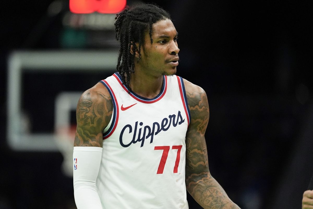 Jan 31, 2025; Charlotte, North Carolina, USA; LA Clippers guard Kevin Porter Jr. (77) reacts to a call during the second quarter against the Charlotte Hornets at Spectrum Center. Mandatory Credit: Jim Dedmon-Imagn Images