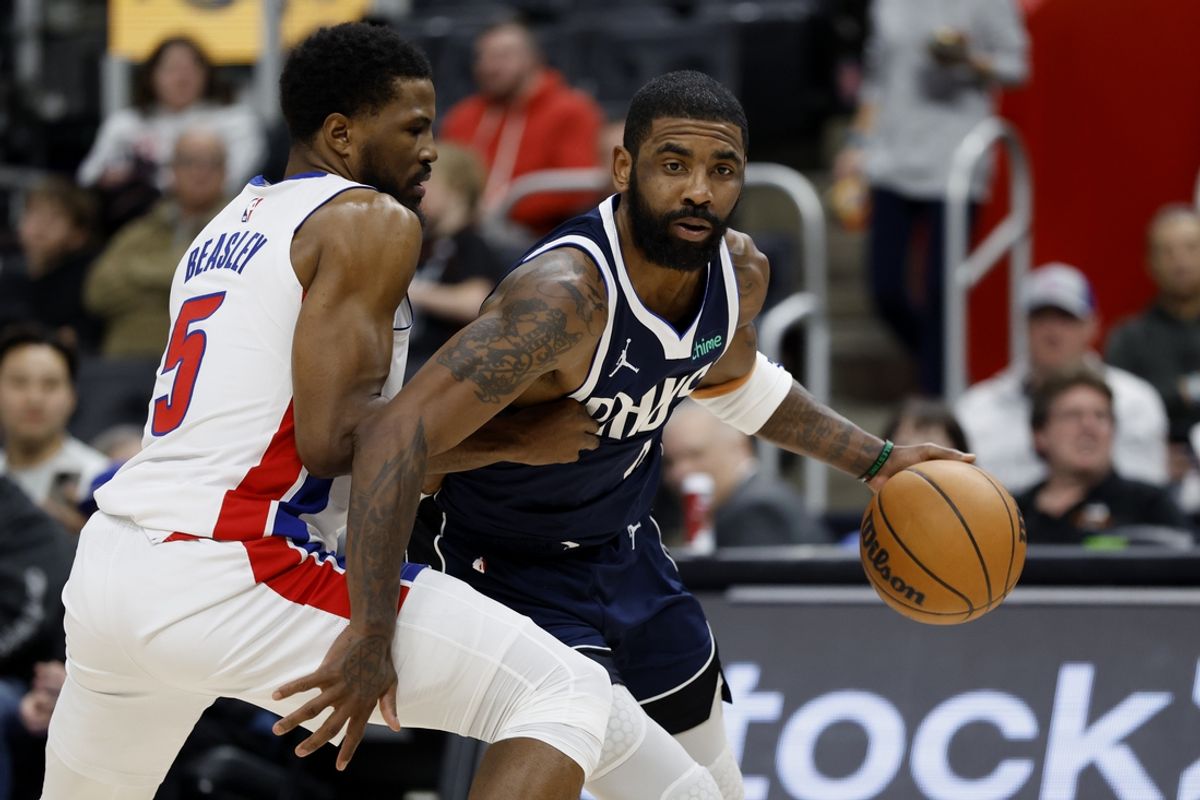 Jan 31, 2025; Detroit, Michigan, USA;  Dallas Mavericks guard Kyrie Irving (11) is defended by Detroit Pistons guard Malik Beasley (5) in the first half at Little Caesars Arena. Mandatory Credit: Rick Osentoski-Imagn Images