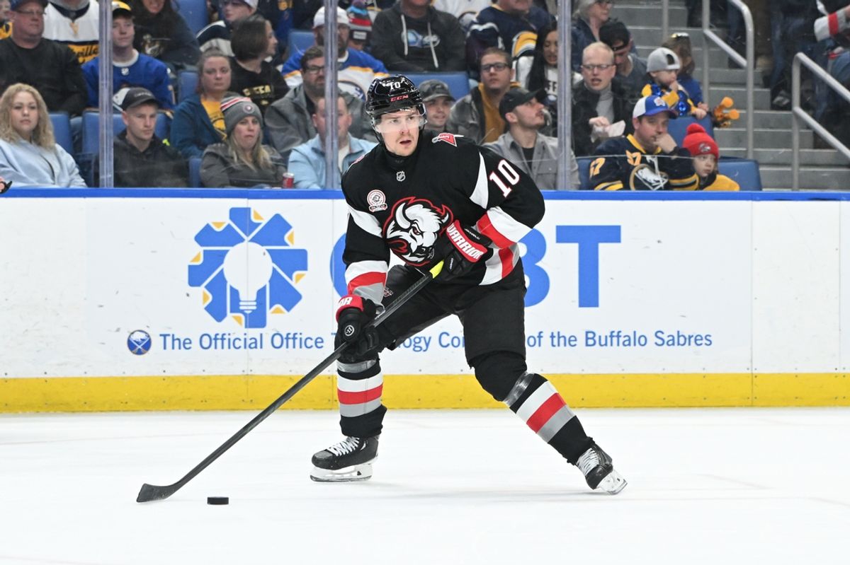 Jan 31, 2025; Buffalo, New York, USA; Buffalo Sabres defenseman Henri Jokiharju (10) skates with the puck in the first period in a game against the Nashville Predators at the KeyBank Center. Mandatory Credit: Mark Konezny-Imagn Images