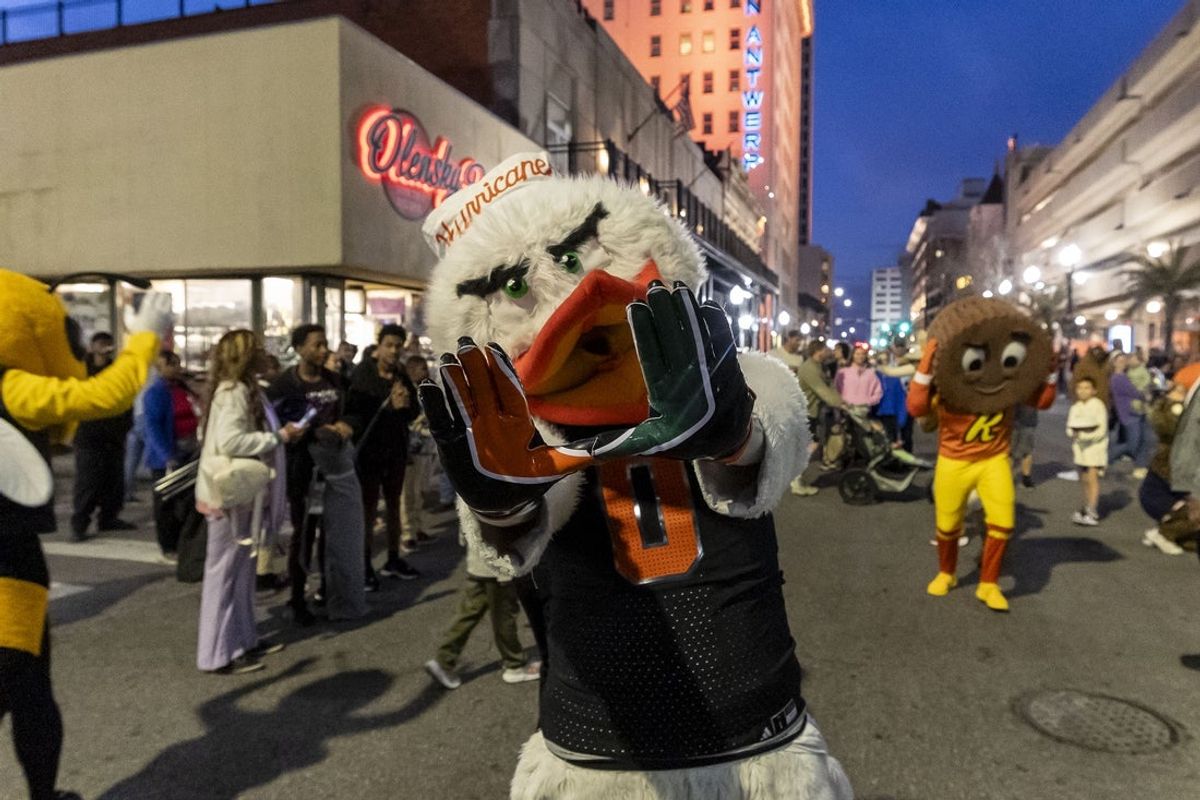 Jan 31, 2025; Mobile, AL, USA; Miami Hurricanes mascot Sebastian the Ibisas joins Senior Bowl football players in the Mardi Gras player parade in downtown Mobile. Mandatory Credit: Vasha Hunt-Imagn Images