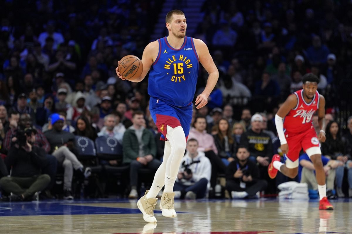Jan 31, 2025; Philadelphia, Pennsylvania, USA; Denver Nuggets center Nikola Jokic (15) controls the ball against the Philadelphia 76ers in the first quarter at Wells Fargo Center. Mandatory Credit: Kyle Ross-Imagn Images