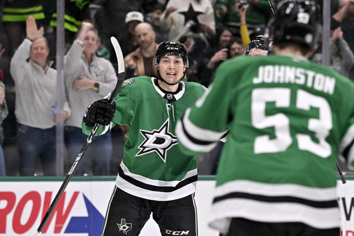 Jan 31, 2025; Dallas, Texas, USA; Dallas Stars left wing Jason Robertson (21) and center Wyatt Johnston (53) celebrates a power play goal scored by Robertson against the Vancouver Canucks during the second period at the American Airlines Center. Mandatory Credit: Jerome Miron-Imagn Images