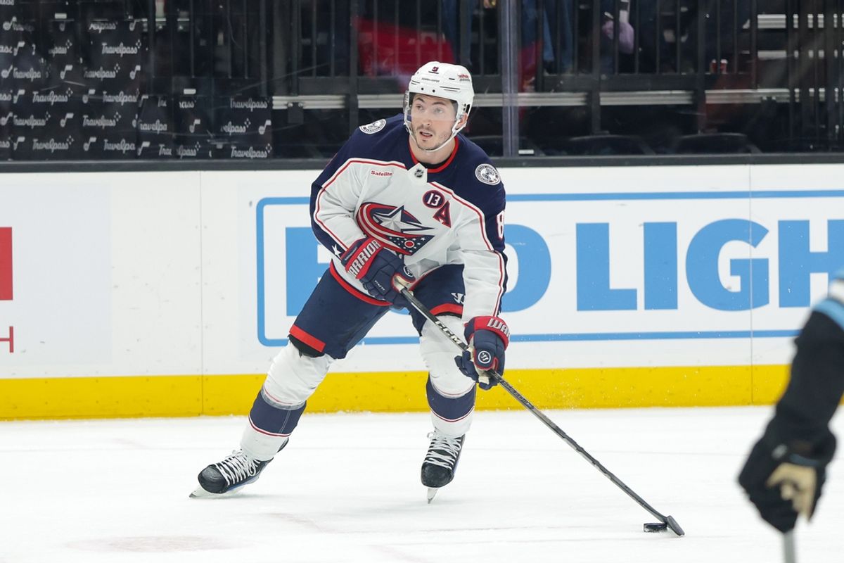 Jan 31, 2025; Salt Lake City, Utah, USA;  Columbus Blue Jackets defenseman Zach Werenski (8) looks to shoot the puck against the Utah Hockey Club during the first period at Delta Center. Mandatory Credit: Chris Nicoll-Imagn Images