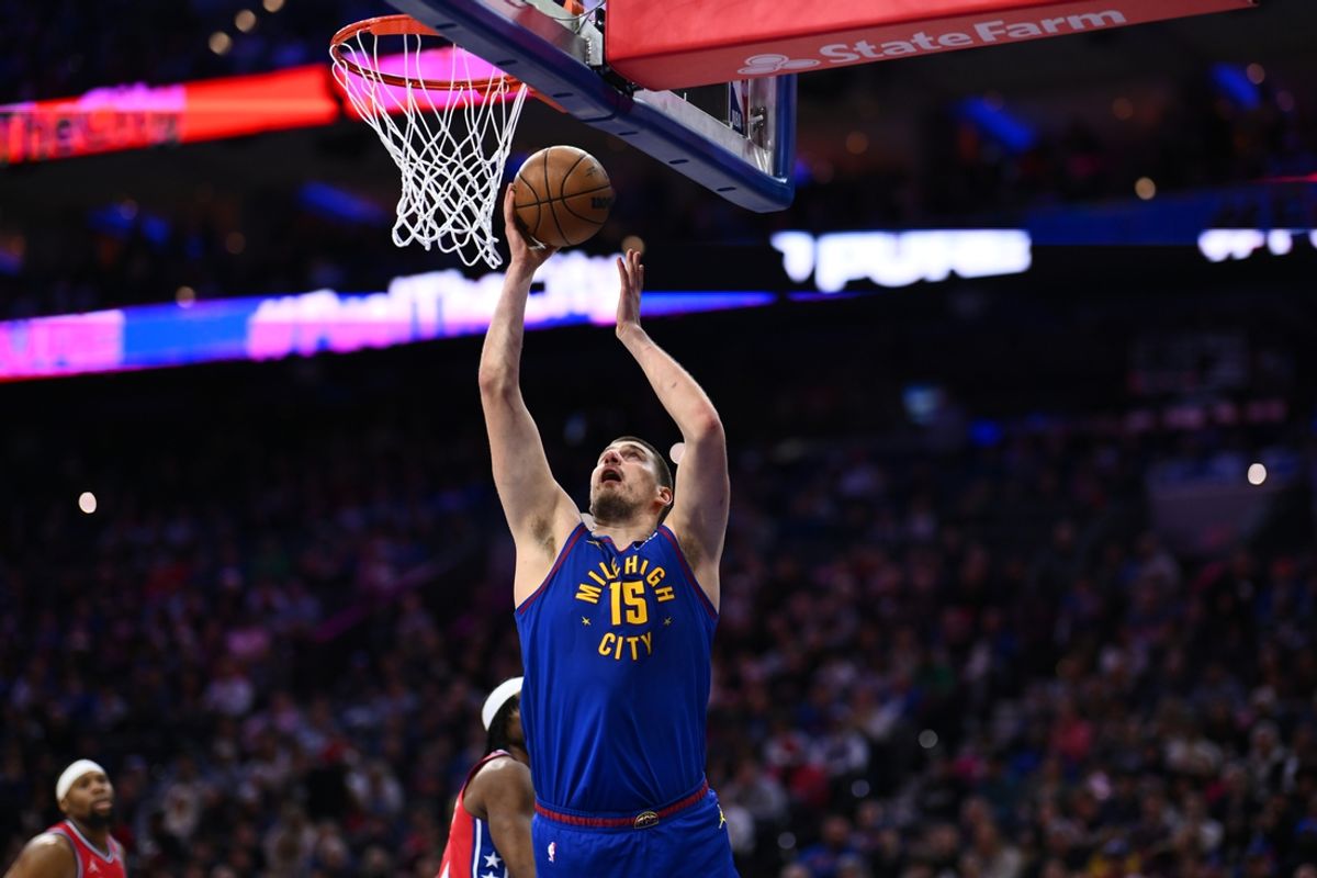 Jan 31, 2025; Philadelphia, Pennsylvania, USA; Denver Nuggets center Nikola Jokic (15) drives to shoot against the Philadelphia 76ers in the second quarter at Wells Fargo Center. Mandatory Credit: Kyle Ross-Imagn Images