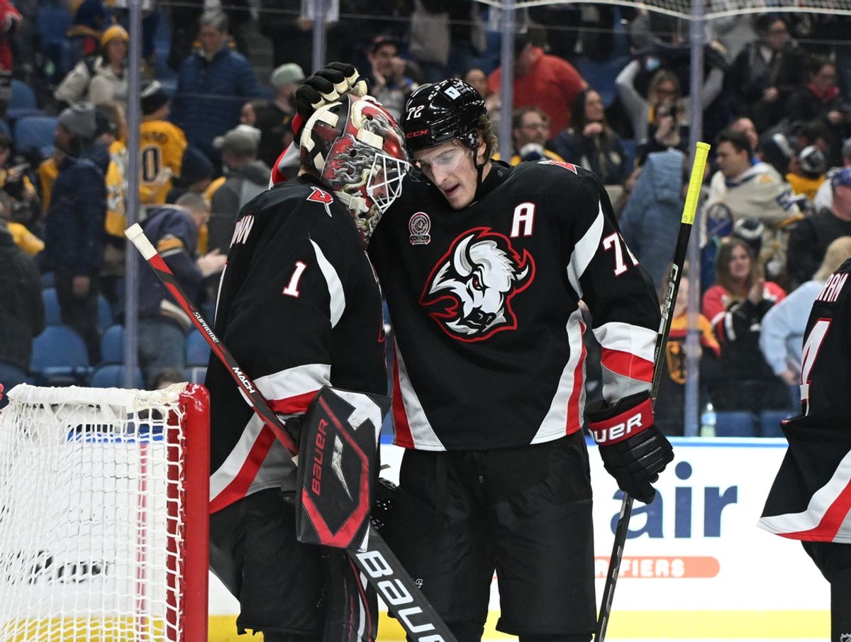 Jan 31, 2025; Buffalo, New York, USA; Buffalo Sabres center Ryan McLeod (71) greets goaltender Ukko-Pekka Luukkonen (1) after a win against the Nashville Predators at the KeyBank Center. Mandatory Credit: Mark Konezny-Imagn Images