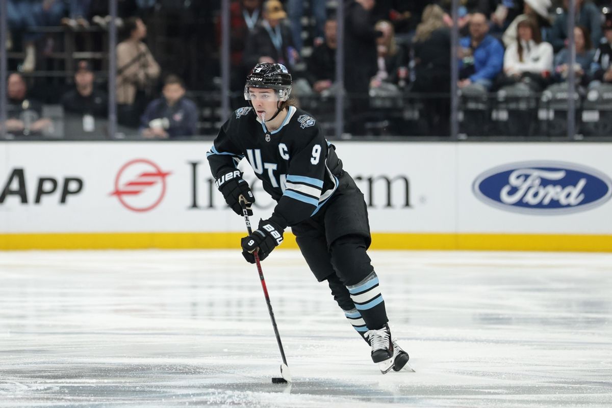 Jan 31, 2025; Salt Lake City, Utah, USA;  Utah Hockey Club center Clayton Keller (9) brings the puck up the ice during the second period against the Columbus Blue Jackets at Delta Center. Mandatory Credit: Chris Nicoll-Imagn Images