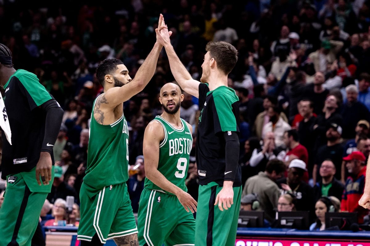 Jan 31, 2025; New Orleans, Louisiana, USA; Boston Celtics forward Jayson Tatum (0) slaps hands with forward Drew Peterson (13) after he makes the go ahead basket to give them the lead against the New Orleans Pelicans with .2 seconds left on the clock during the second half at Smoothie King Center. Mandatory Credit: Stephen Lew-Imagn Images