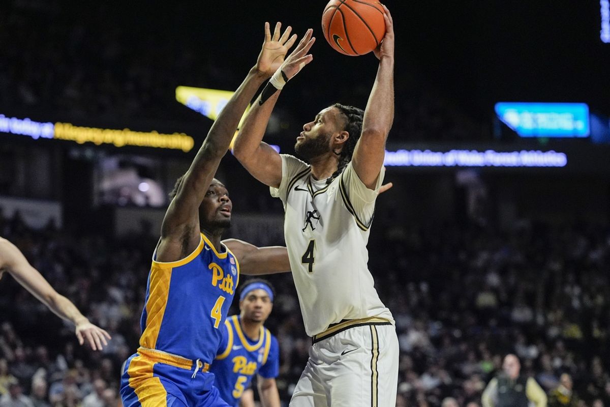 Feb 1, 2025; Winston-Salem, North Carolina, USA; Wake Forest Demon Deacons forward Efton Reid III (4) drives to the basket against Pittsburgh Panthers forward Papa Amadou Kante (4) during the first half at Lawrence Joel Veterans Memorial Coliseum. Mandatory Credit: Jim Dedmon-Imagn Images