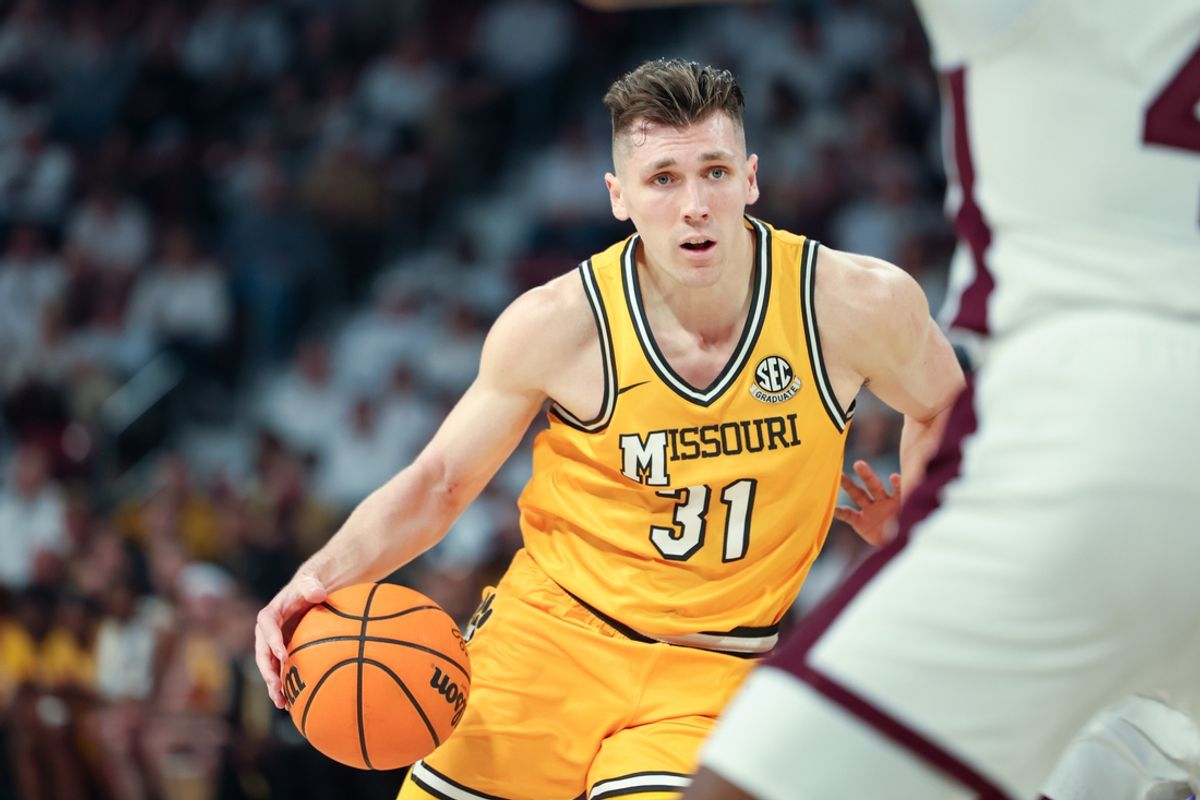 Feb 1, 2025; Starkville, Mississippi, USA; Missouri Tigers guard Caleb Grill (31) drives to the basket against the Mississippi State Bulldogs during the first half at Humphrey Coliseum. Mandatory Credit: Wesley Hale-Imagn Images