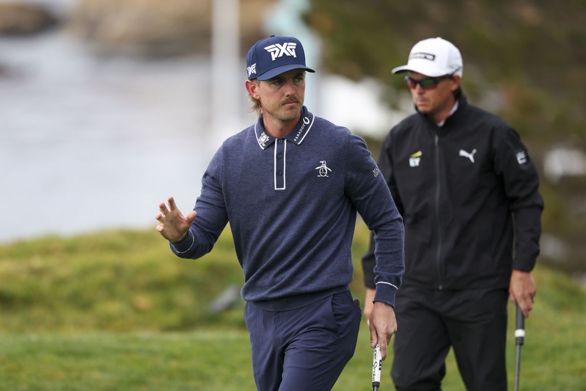 Feb 1, 2025; Pebble Beach, California, USA; Jake Knapp acknowledges the crowd after making his putt on the fourth hole during the third round of the AT&T Pebble Beach Pro-Am golf tournament at Pebble Beach Golf Links. Mandatory Credit: Kiyoshi Mio-Imagn Images