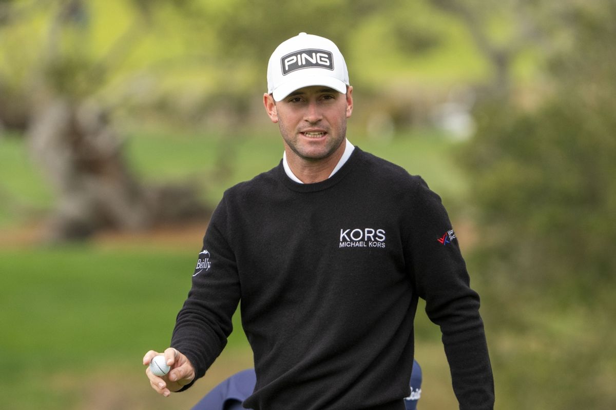 February 1, 2025; Pebble Beach, California, USA; Austin Eckroat acknowledges the crowd after making his putt on the second hole during the third round of the AT&T Pebble Beach Pro-Am golf tournament at Pebble Beach Golf Links. Mandatory Credit: Kyle Terada-Imagn Images